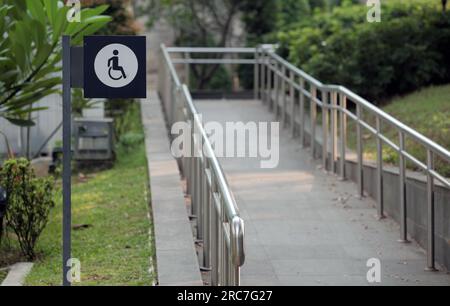 Jakarta, Indonesia - sept 08, 2025 : crossing road sign for persons with disabilities Stock Photo