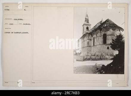 The photograph shows a Church in Caispach, Alsace. It was taken on March 18, 1919, by the Signal Corps of the American military. The picture depicts a church building with a U.S.-issued symbol. It is located in Caispach, Alsace. Stock Photo