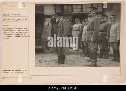 Sgt. L.J. Rode, S.C., captured this photograph on July 23, 1918, in Chaumont, France. The image shows French Premier M. Georges Clemenceau and General John J. Pershing reviewing the Guard of Honor at the GH.Qe station. The photograph was censored and passed by the A.E.F. on July 8th, 1918. (52) Stock Photo