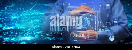 A man in a blue shirt is in control of the development of deep machine learning, artificial intelligence, neural networks, big data and real-time chat Stock Photo