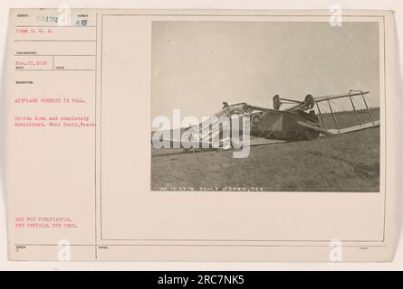 This image features an airplane that has crashed upside down and is completely destroyed. The photograph was taken near Ennis, Texas on November 21, 1918. It is part of the D. M. A. 54172 photo collection and is labeled as AU, meaning it is not for publication and is for official use only. Additional notes indicate that the crash occurred on October 28, 1918, about 2 miles east of Ennis, Texas. Stock Photo