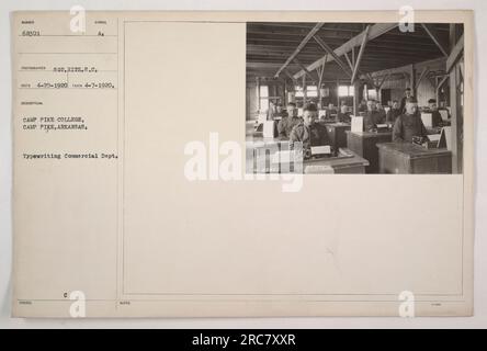 Image: A photograph taken on April 7, 1920, at Camp Pike College in Camp Pike, Arkansas. The image shows the Typewriting Commercial Department. The photographer is identified as Sot. Hitz, U.S. Signal Corps. The official reco number for this photo is 420-1920 with the identifier 68301. Stock Photo