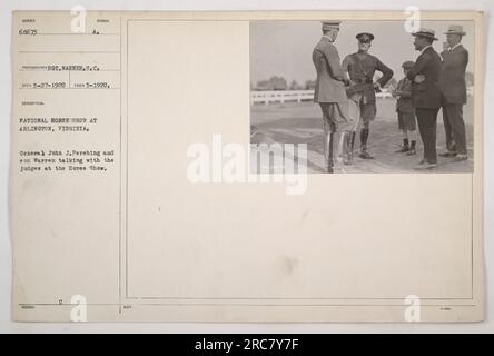 Caption: General John J. Pershing and his son Warren engaging in conversation with the judges at the National Horse Show in Arlington, Virginia. The photograph was taken in May 1920 and later issued as an official image of American military activities during World War One. Stock Photo