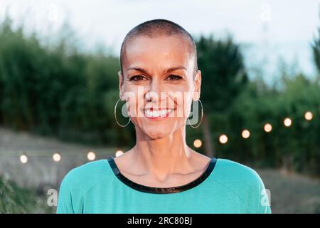 Stylish modern elderly woman. Standing smiling at the camera with