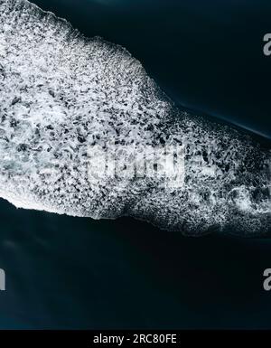 Water splashing out from the center on both sides. Space for text and design Stock Photo