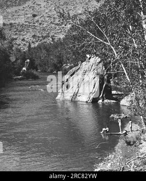 1940s THREE BOYS OUTDOOR IN SWIMMING HOLE - Stock Photo