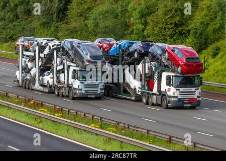 BCA British Car Auctions car transporter, Lorries & Trucks, shipping freight, heavy haulage, lorry logistics, collection and deliveries, Scania delivery transport vehicles on the M6, Manchester, UK Stock Photo