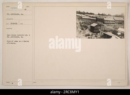 A photograph taken on May 10, 1919, showing War Prison Barracks No. 1 at Ft. McPherson, Georgia. The camp is seen on a Sunday afternoon, with no specific details mentioned. Additional notes mention the photograph's description symbol and its issuance by the Army War Prison Barracks. Stock Photo