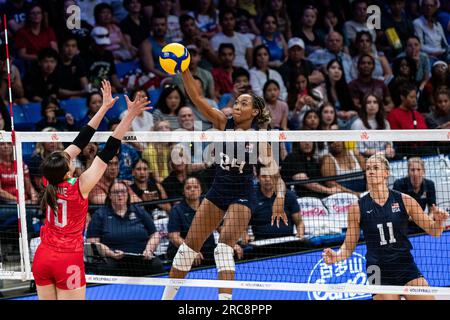 Arlington, USA. 12th July, 2023. Ogbogu Chiaka (C) of the United States spikes the ball during the quarterfinal match between the United States and Japan at the Women's Volleyball Nations League in Arlington, the United States, July 12, 2023. Credit: Chen Chen/Xinhua/Alamy Live News Stock Photo