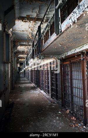 Looking down a row of prison cells in the East Cell Block of the Old Joliet Prison, which opened in 1858 and closed and was abandoned in 2002. Stock Photo