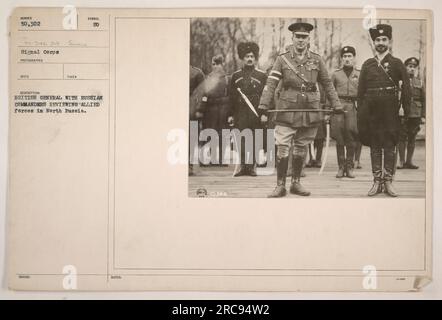 British General and Russian commanders observing Allied forces in North Russia during World War One. The photograph was taken by the Signal Corps, depicting the review of troops by senior military personnel. The location is identified as N 50,302 sc 346 24 Same. Stock Photo