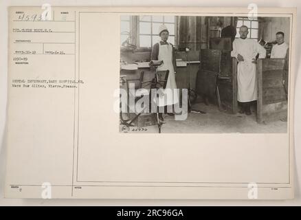 'Photograph of the Dental Infirmary at Base Hospital 62 in Mars sur Allier, Nievre, France. The image shows Private Clyde Eddy, a Photographer of the Signal Corps, documenting the activities. The photograph was taken on June 19, 1919. The description number for this image is 1990-199.' Stock Photo