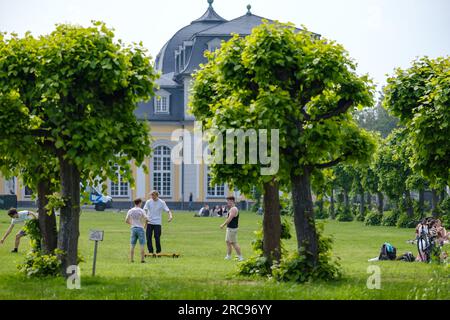 Bonn, Germany - May 22, 2023 : Young people, mostly students enjoying the beautiful public park at the Poppelsdorfer Allee in Bonn Germany Stock Photo