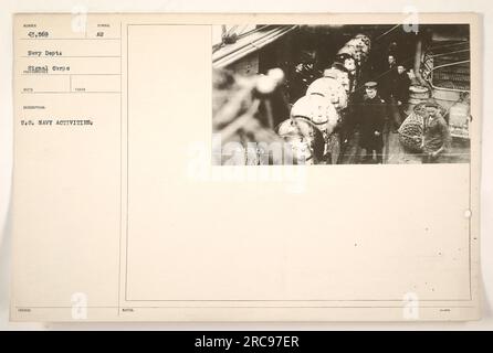 American Navy sailors engaging in military activities during World War One. The photograph is taken by the US Navy Department Signal Corps. The image is part of a collection documenting various naval activities during the war. The assigned descriptive number for reference is 43,569. Stock Photo