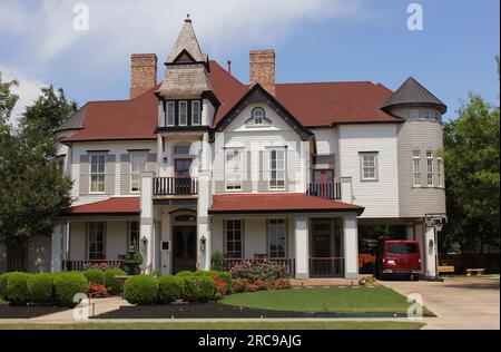 Old Gingerbread Style Mansion Located in Rural South East TX Stock Photo