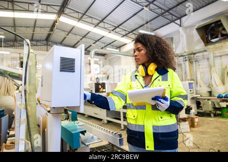 staff woman worker work operate cutting machine. Lathe CNC engineer. modern factory working woman. smart women worker industry workplace Stock Photo