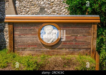 A wooden board in remembrance of Hilaire Belloc and family members in the graveyard of Shrine of Our Lady of Consolation church, West Sussex, England. Stock Photo