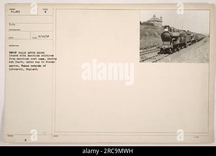 American soldiers can be seen boarding a troop train at Knotty Ash Depot in Liverpool, England. The soldiers are on their way to Southampton, from where they will be transported overseas as part of their military duties during World War I. This photograph was taken on August 14, 1918. Stock Photo