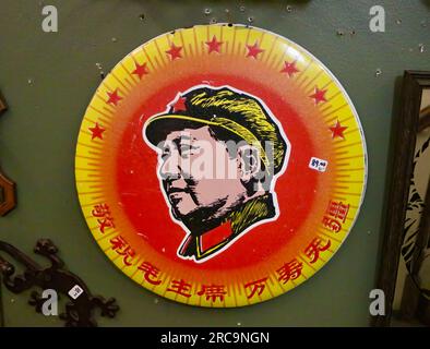 Photo of an enamelled metal wall plaque with a portrait of Mao Tse-Tung for sale in an antique shop Snohomish Washington State USA Stock Photo