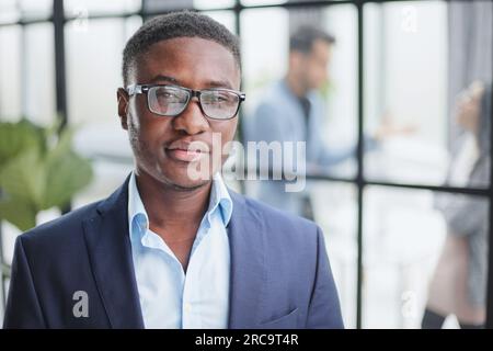 Handsome young man in design office posing at camera Stock Photo