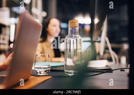Water bottle and glass on desk at office Stock Photo