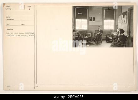 This is a photograph of a ladies' rest room in the telephone exchange at Camp Devens, M89. The image is cataloged under the identification number 43398, taken by a photographer under the S.C. division. Stock Photo