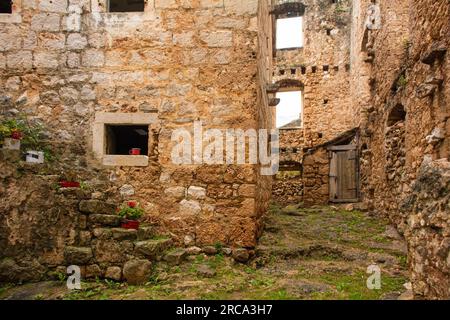 'House Within a House', or Kuca U Kuci, in Bol town on Brac Island in Croatia. In the 19th century, a newer house was built around an existing house Stock Photo