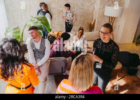 High angle view of business colleagues discussing during event at convention center Stock Photo