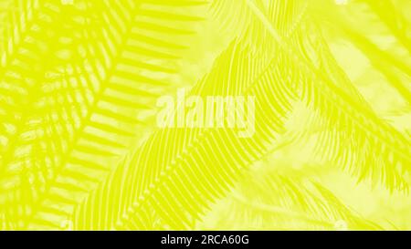 Vivid yellow lemon color abstract panoramic background with palm leaves pattern Stock Photo