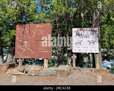 The Yaak River Falls Sign near Libby, MT on a bright sunny day in May, Stock Photo