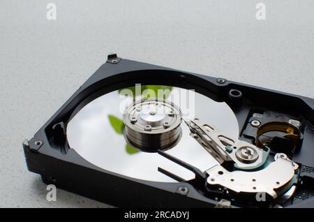 Close-up detail of a disassembled HDD, showing its internal structure and technology for reading and writing data. Stock Photo