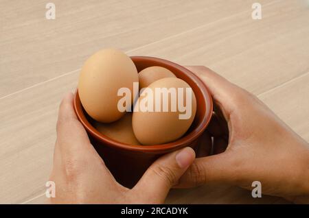 Lovely detail of brown chicken eggs, bringing a natural and healthy touch to your meal. Stock Photo