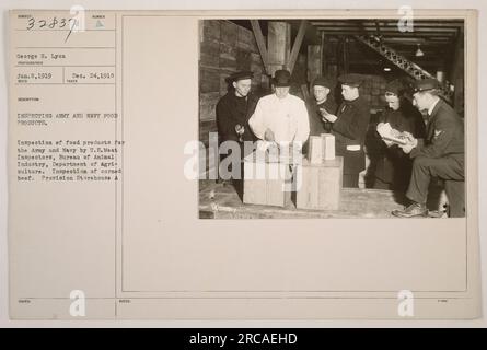 US Meat Inspectors from the Bureau of Animal Industry, Department of Agriculture, inspecting corned beef at a Provision Storehouse on December 24, 1918. This image shows the process of inspecting food products for the Army and Navy during World War I. Stock Photo