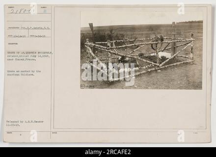 Caption: Grave of Lt. Quentin Roosevelt, Aviator, killed on July 14, 1918 near Chaney, France. The grave is marked by American soldiers. This photograph, taken on August 24, 1918 by Pvt. R.P. Antrim, shows the somber tribute to the fallen aviator. (Note: Information provided on photograph release - A.E.F. Censor 11-22-18) Stock Photo