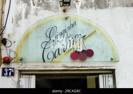 Ginginha do Carmo in Lisbon, Portugal. Famous small bar at the stairs of Calçada do Carmo serving Ginjinha, a Portuguese cherry liqueur. Stock Photo