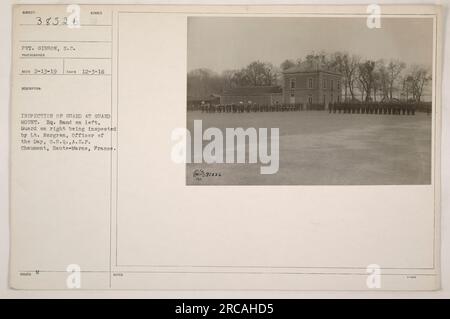 Caption: 'Pvt. Gibbon from S.C. captured this image during World War One. The photo, tagged as 111-SC-38526, shows a guard mount at Headquarters in Chaumont, France. Lt. Nergren can be seen inspecting the Guard while the Hq. Band stands on the left. Date: 12-3-18. (Reco 2-13-19)' Stock Photo