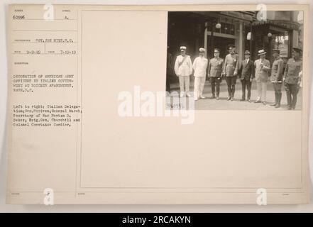 Italian government bestows decorations upon American Army officers in a ceremony held at Roucher Apartments in Washington, D.C. Pictured from left to right are the Italian Delegation, Gen. Scriven, General March, Secretary of War Newton D. Baker, Brig. Gen. Churchill, and Colonel Constance Cordier. Photo taken on July 19, 1919. Stock Photo