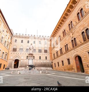 Siena, Italy - APR 7, 2022: The Piazza Salimbeni is a prominent square in central Siena, Region of Tuscany, Italy. The square hosts multiple landmarks Stock Photo