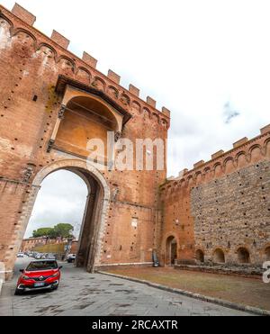 Siena, Italy - APR 7, 2022: Porta Romana is one of the portals in the medieval Walls of Siena. It is located on Via Cassia in Siena, region of Tuscany Stock Photo