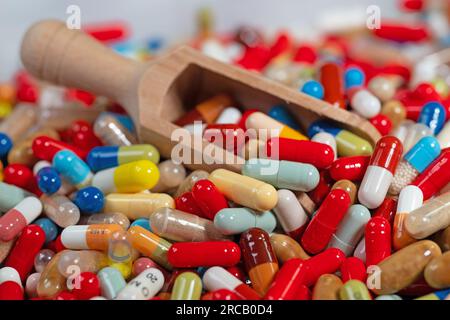 Many colorful capsules and tablets in a closeup Stock Photo