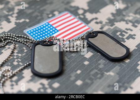 Camouflage uniform, dog tags, American Flag Stock Photo