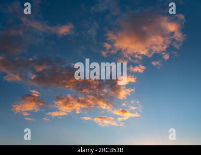 Clouds glow orange in the evening light, wallpaper, sky replacement Stock Photo