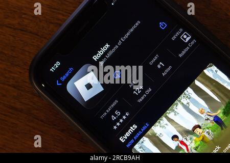 In this photo illustration, the Roblox app seen displayed on a smartphone  screen and a Roblox logo in the background. (Photo by Thiago Prudencio /  SOPA Images/Sipa USA Stock Photo - Alamy