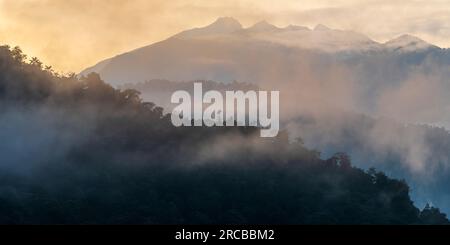 Cloud forest sunrise panorama and Andes mountain peaks, Mindo cloud forest, Quito region, Ecuador. Stock Photo
