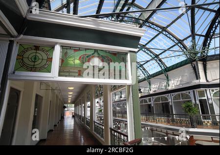 Art Nouveau coloured glass adorns an upper level gallery inside the Wayfarer's Arcade, off Lord Street, Southport. Stock Photo