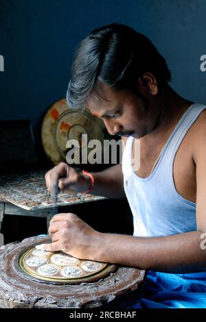 An artisan making Thanjavur Art Plate at Thanjavur Tanjore, Tamil Nadu ...