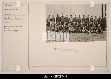 'U.S. Aerial Fliers at Kelly Field, San Antonio, Texas, during World War I. This photograph, labeled number 34,329, was taken in January 1919 and issued by the D.M.A. Photographer. The image captures the American military pilots in their uniforms, ready for duty at Kelly Field. This picture is marked as 'FOR OFFICIAL USE ONLY.' Stock Photo