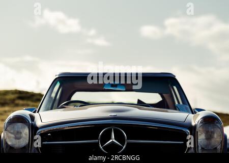Oldtimer mercedes benz car, low angle, front view with copyspace sky Stock Photo