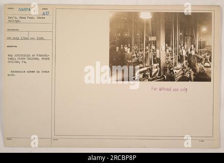 Mechanics class at Pennsylvania State College in State College, PA engaging in lathe work as part of their war activities during World War I. This photograph was taken in 1918 and is subject number 55374. It was received from Pennsylvania State College and taken by Photographer Reco on July 1, 1918. For official use only. Stock Photo