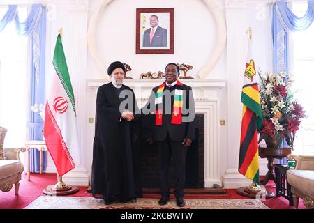 Harare, Harare, Zimbabwe. 13th July, 2023. Zimbabwe President EMMERSON MNANGAGWA (R) meets Iranian President EBRAHIM RAISI (L) in Harare. (Credit Image: © Iranian Presidency via ZUMA Press Wire) EDITORIAL USAGE ONLY! Not for Commercial USAGE! Stock Photo